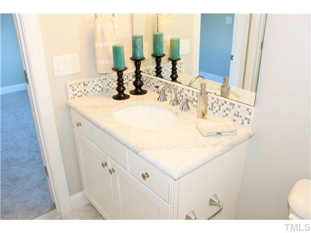 2613 Packhouse Road Zebulon, NC 27597 - Photo 23 of 25 Secondary bath beautiful granite decorative tile surround.