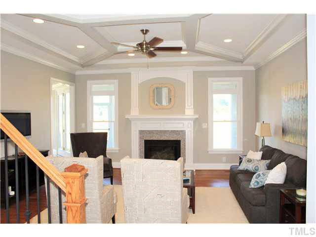 2613 Packhouse Road Zebulon, NC 27597 - Photo 6 of 25 Beautiful attention to detail with unique trey heavy molding natural gas fire logs recessed lighting.