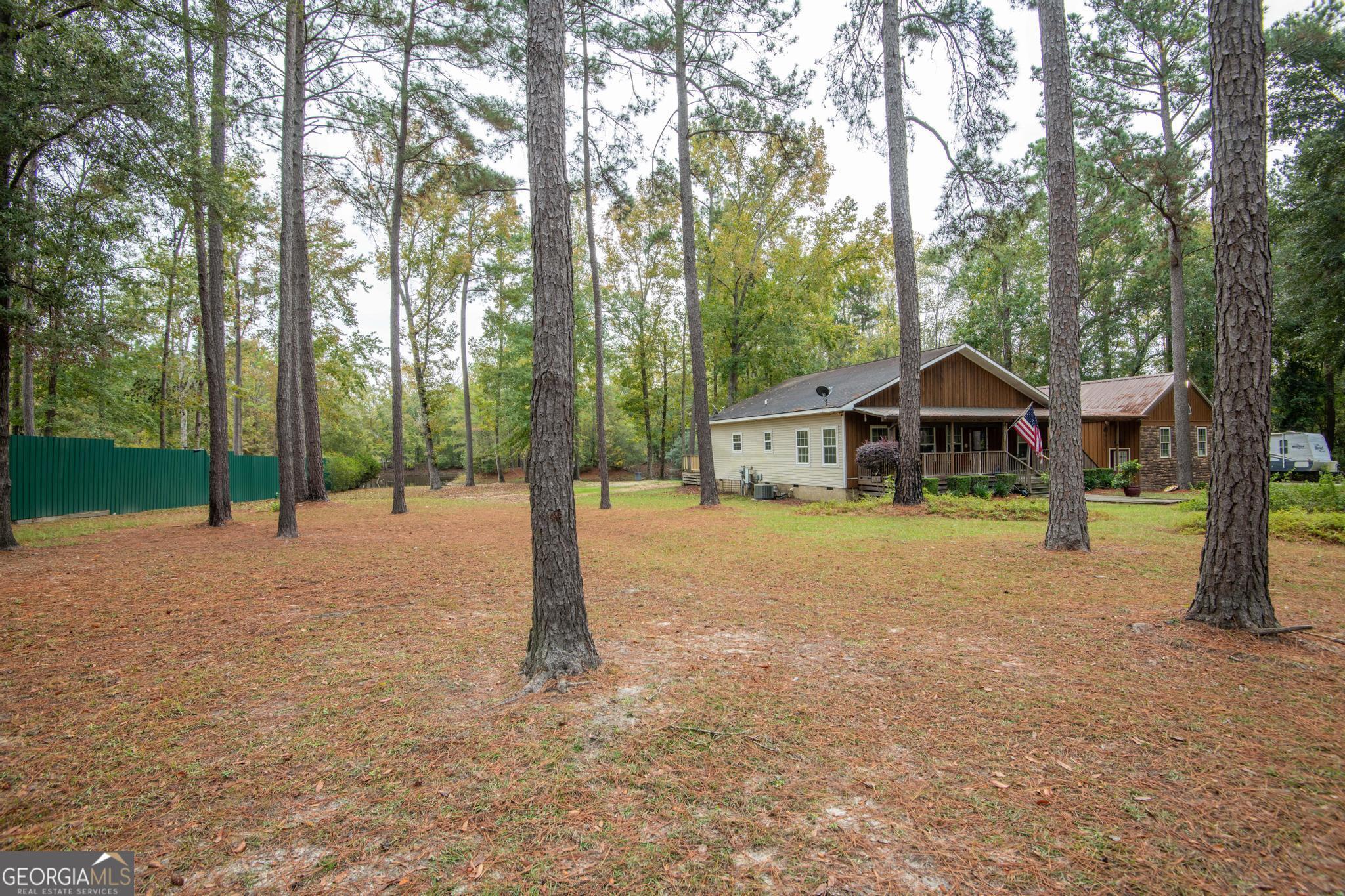 363 Dover Road Sylvania, GA 30467 - Photo 19 of 27 a house with trees in the background