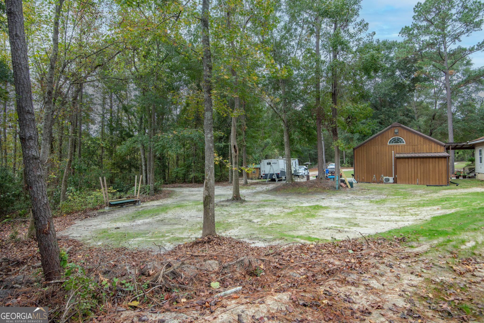 363 Dover Road Sylvania, GA 30467 - Photo 22 of 27 a view of a house with backyard and trees