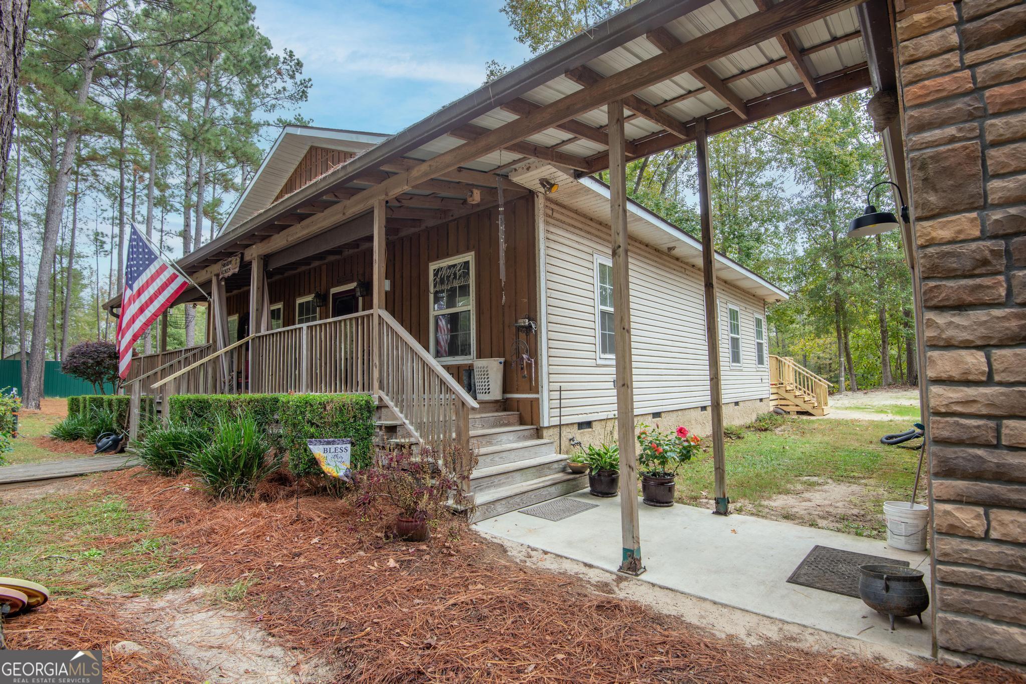 363 Dover Road Sylvania, GA 30467 - Photo 24 of 27 a front view of a house with garden