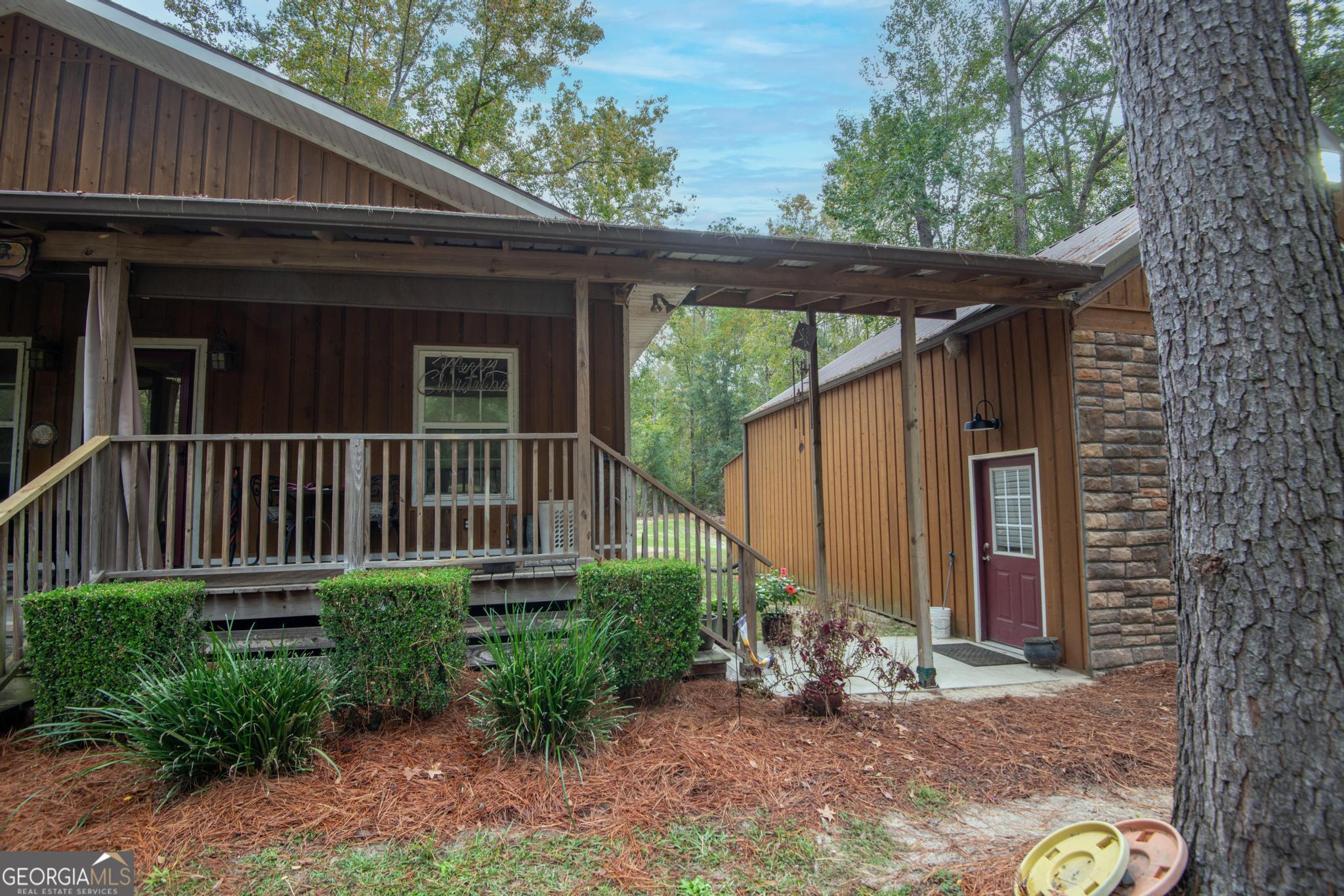363 Dover Road Sylvania, GA 30467 - Photo 25 of 27 a view of a house with backyard and sitting area
