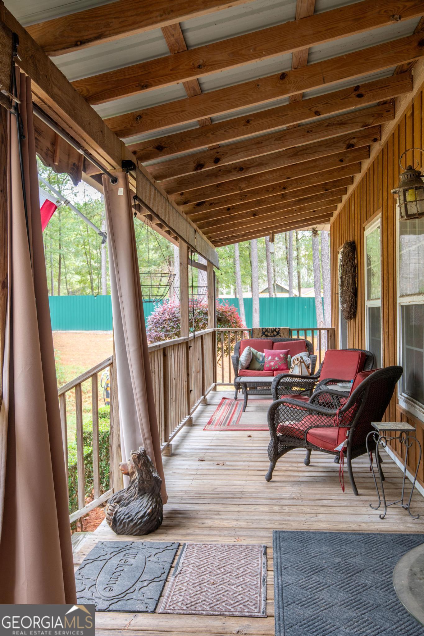 363 Dover Road Sylvania, GA 30467 - Photo 26 of 27 a living room with furniture and a floor to ceiling window