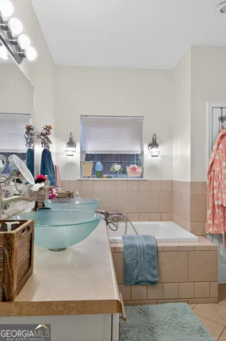 a living room with hard wood flooring and a couch