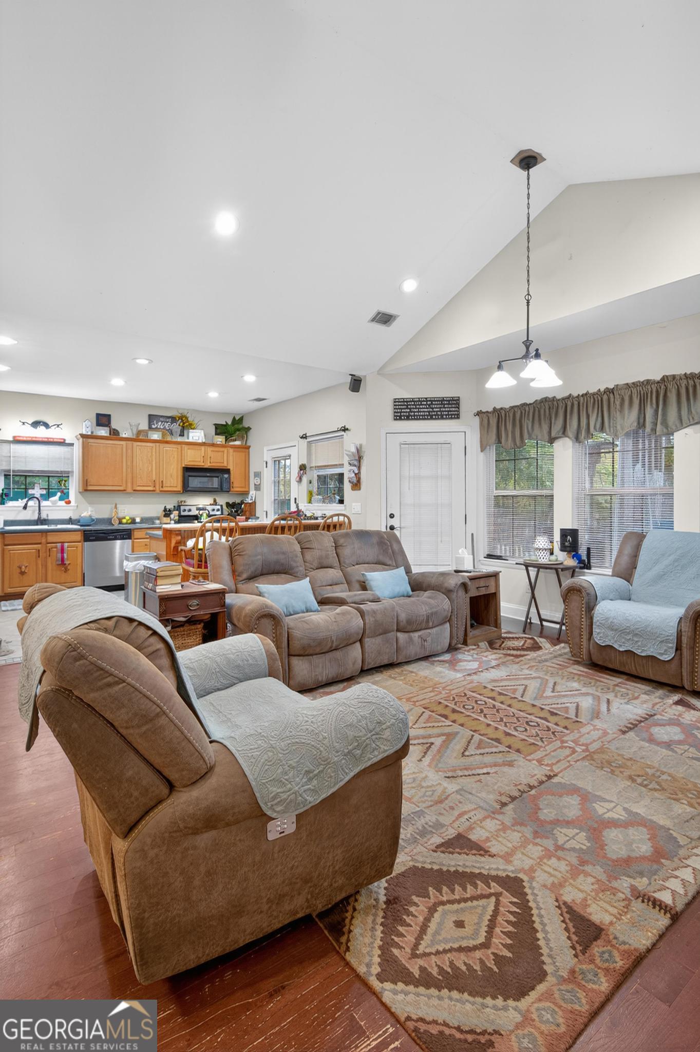 363 Dover Road Sylvania, GA 30467 - Photo 5 of 27 a living room with furniture and a chandelier
