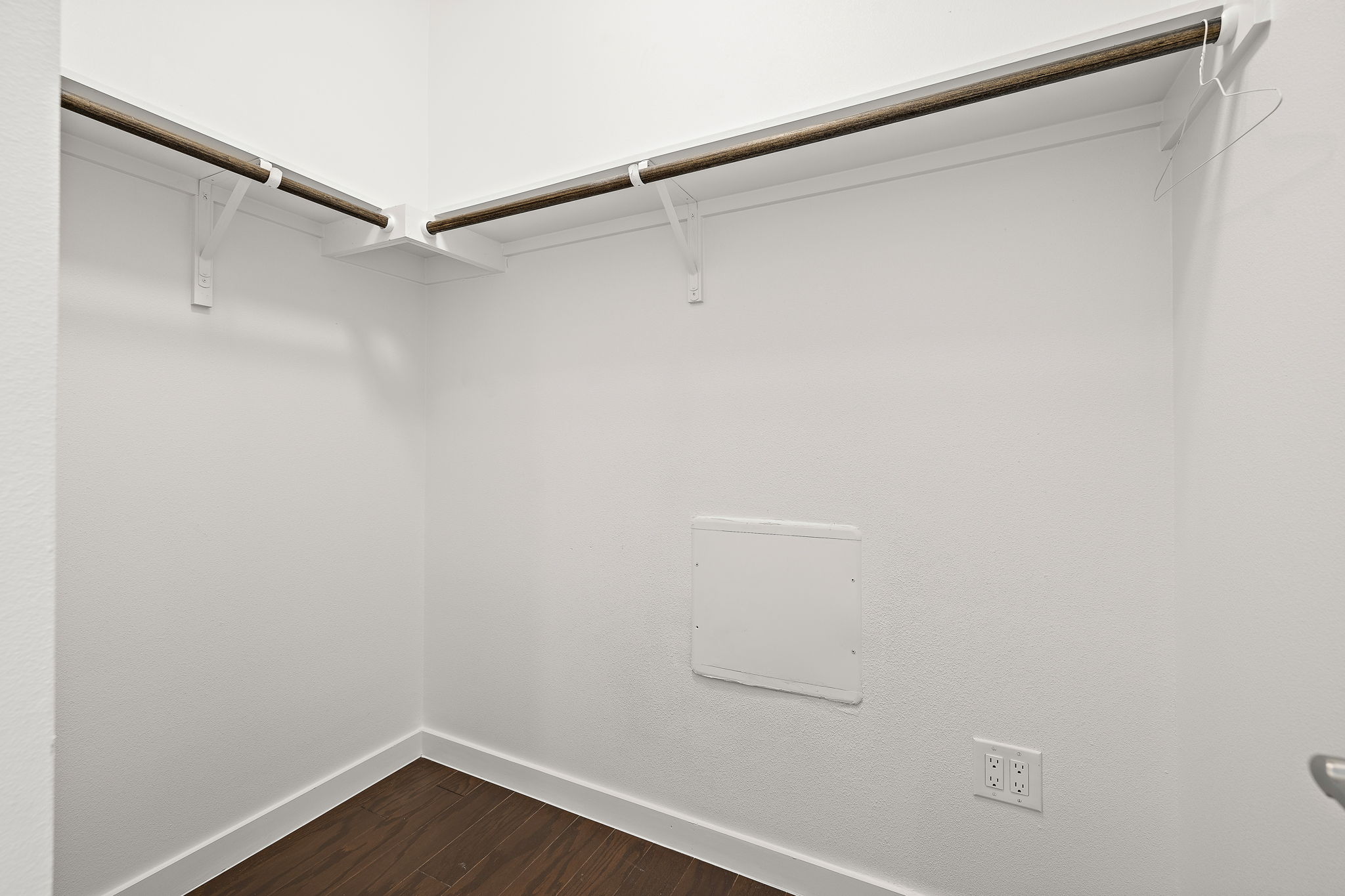 1206 Sarabeth Way Austin, TX 78721 - Photo 22 of 27 Spacious closet with dark wood finished floors