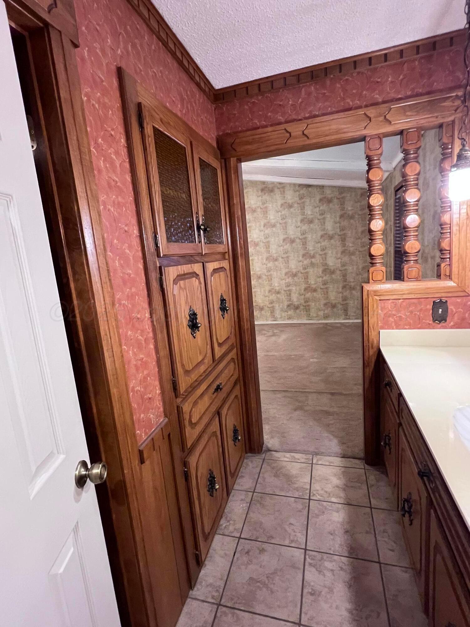 807 North Arrah Friona, TX 79035 - Photo 26 of 56 a bathroom with a bathtub and a sink