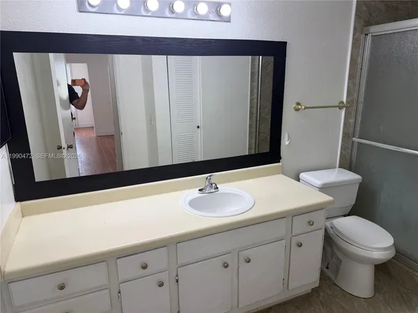 a bathroom with a shower and a toilet