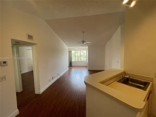 a view of kitchen and wooden floor