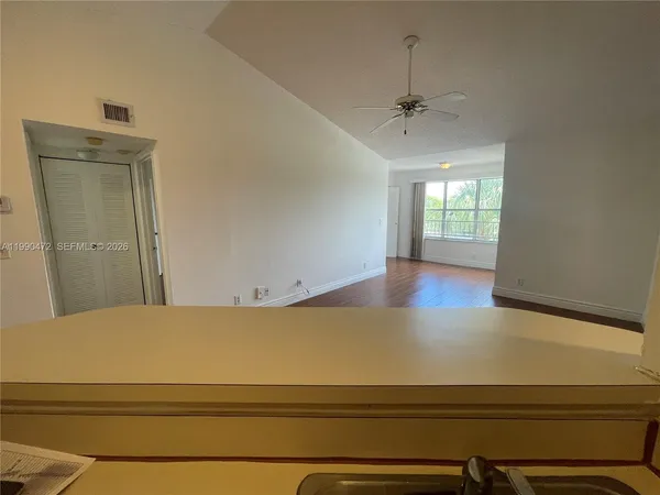 a view of an empty room with a window