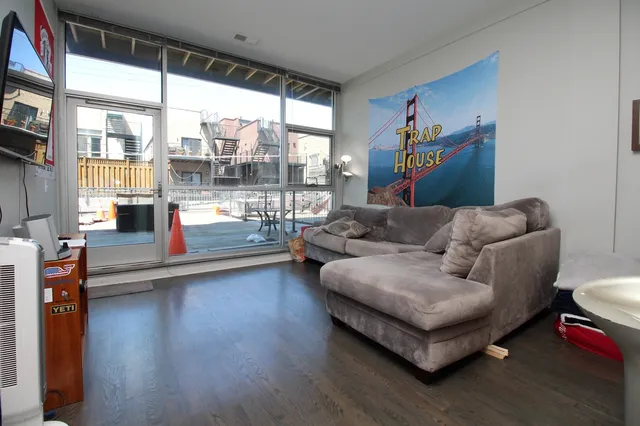 a kitchen with stainless steel appliances granite countertop a refrigerator a stove a sink and a microwave