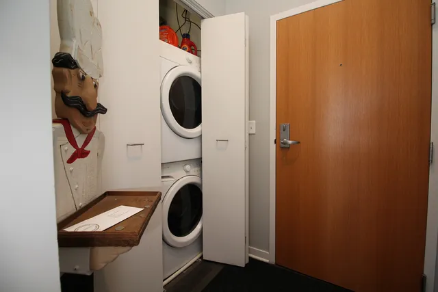a bathroom with a granite countertop sink a mirror and shower