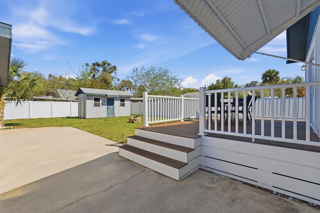 231 North Ridgewood Avenue Ormond Beach, FL 32174 - Photo 31 of 52 a view of a house with backyard and porch