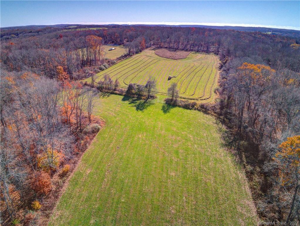 a view of a swimming pool with an outdoor space and seating area