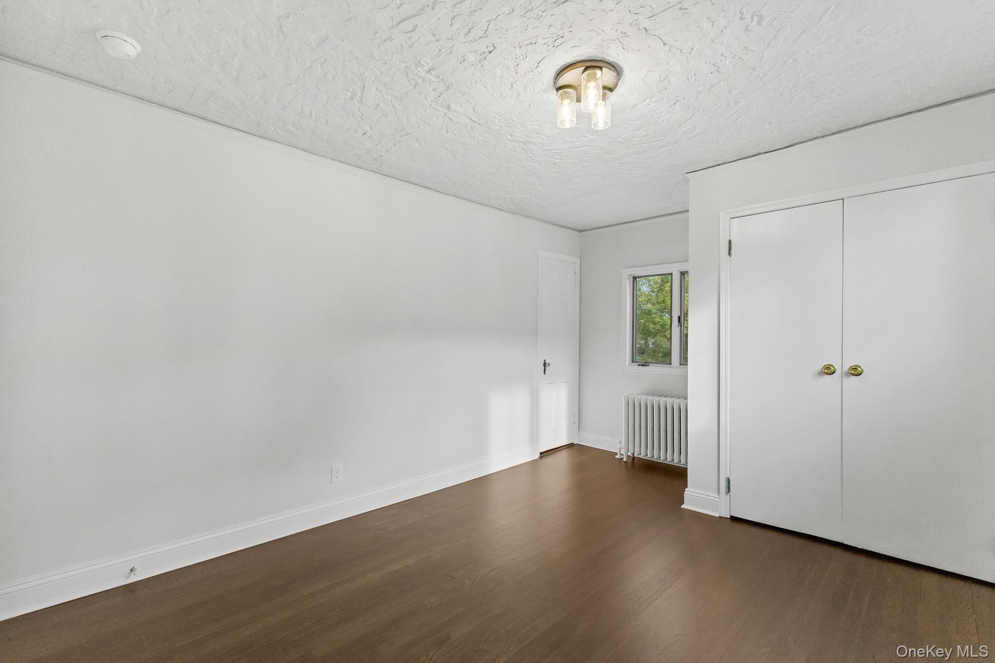 202 East Garden Road Larchmont, NY 10538 - Photo 21 of 35 a view of a room with wooden floor