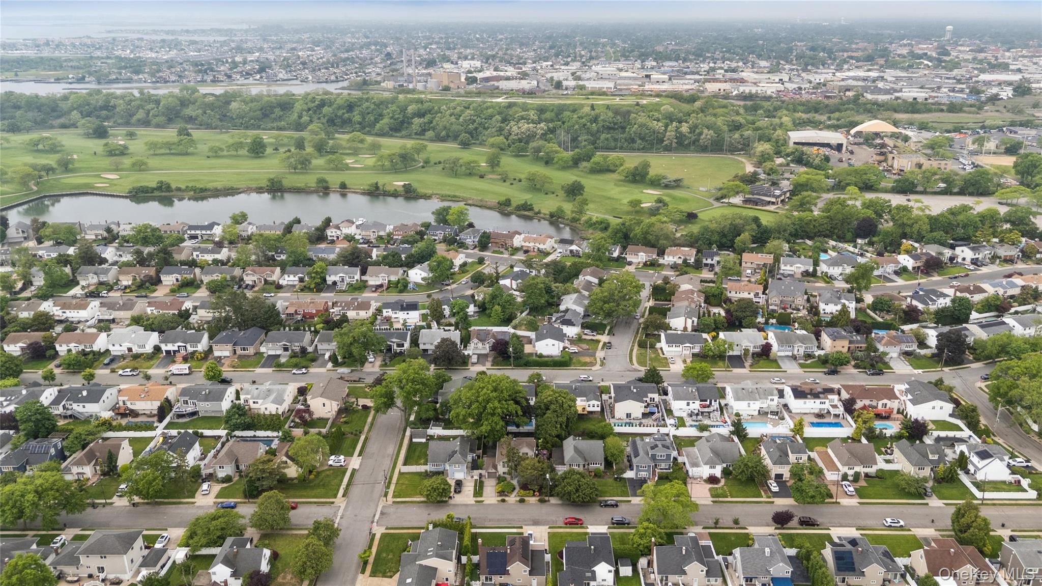 2772 Riverside Avenue Merrick, NY 11566 - Photo 39 of 45 an aerial view of residential houses with outdoor space and trees