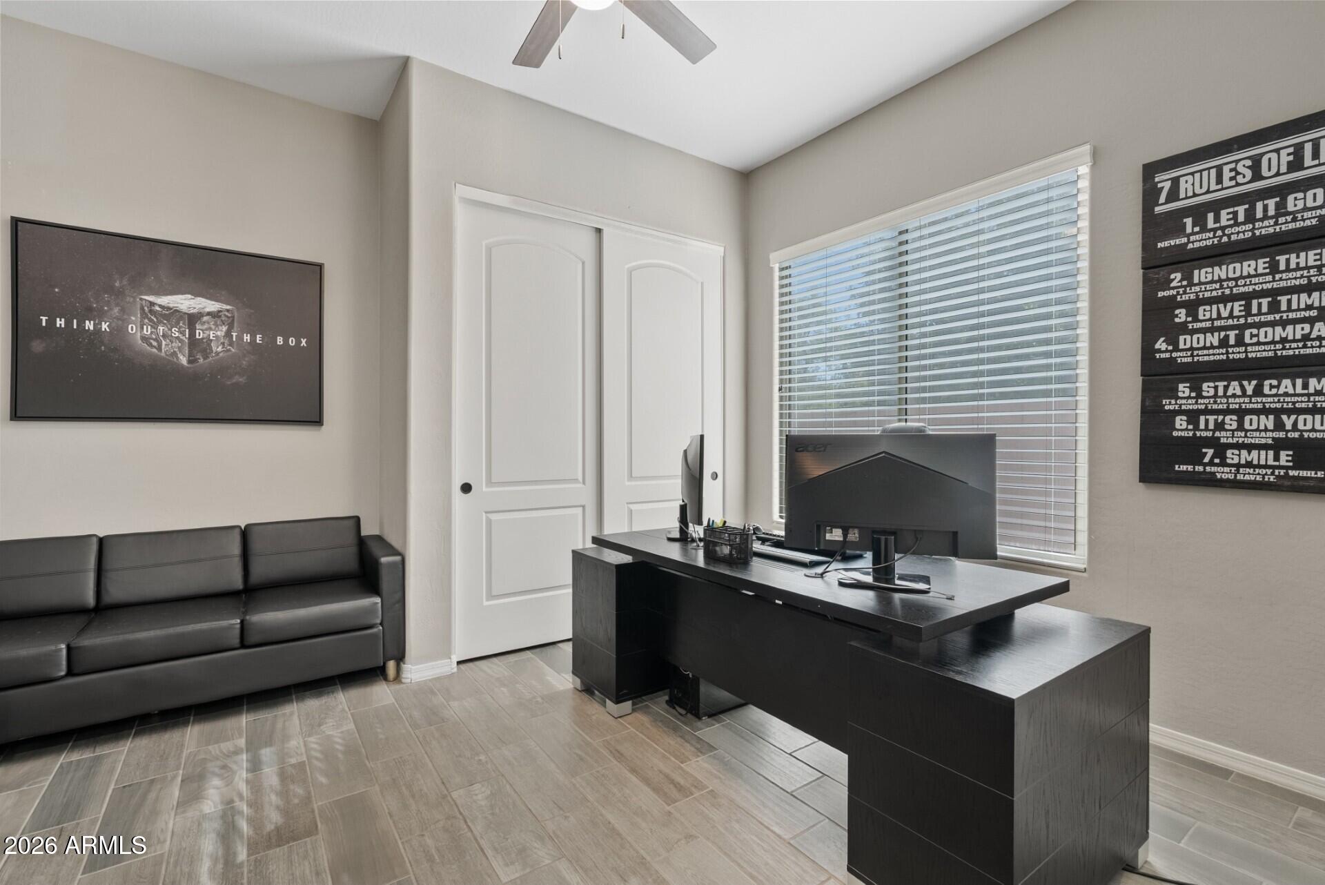 19411 East Timberline Road Queen Creek, AZ 85142 - Photo 11 of 44 a living room with furniture and a fireplace