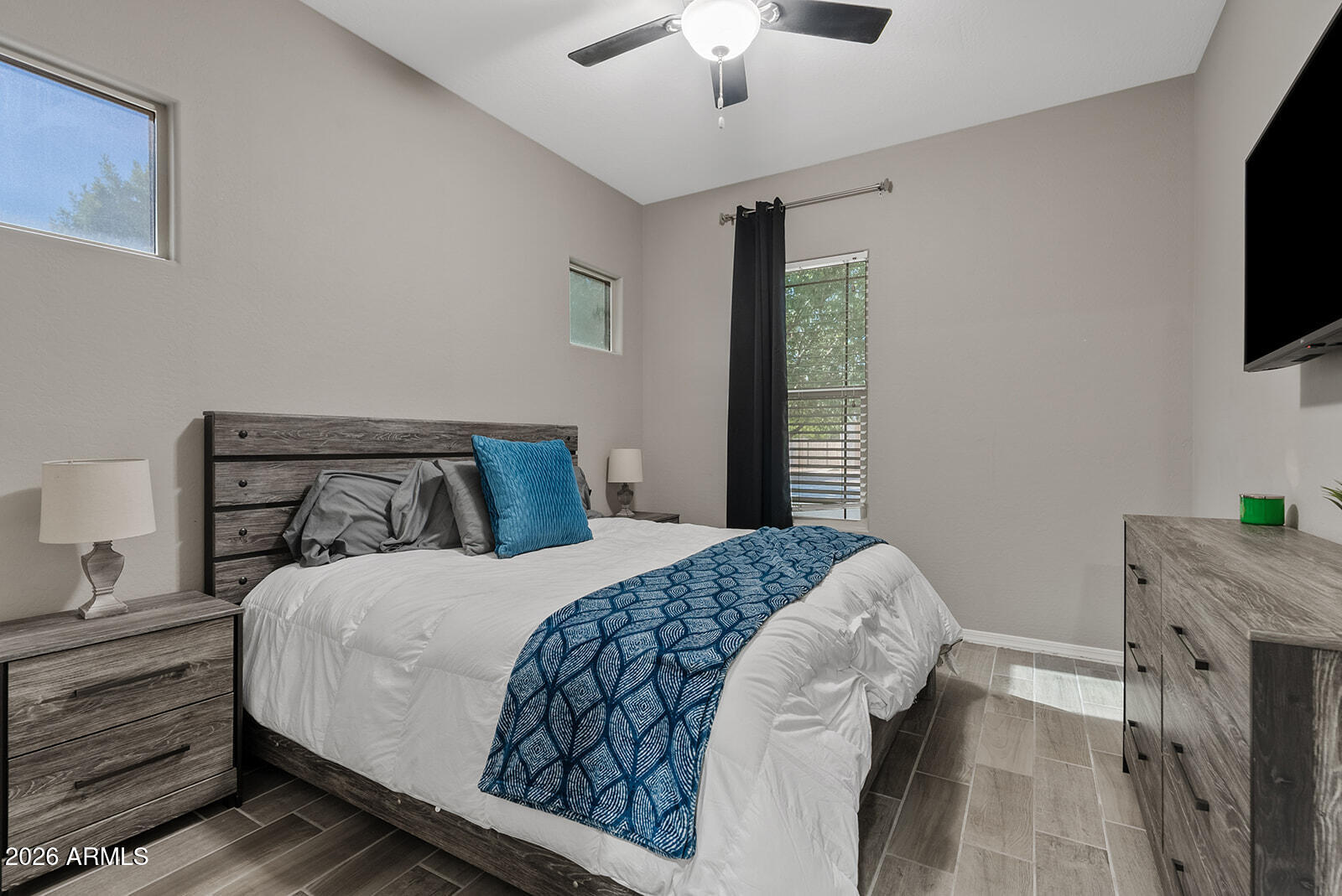 19411 East Timberline Road Queen Creek, AZ 85142 - Photo 13 of 44 a bedroom with a bed and a flat screen tv