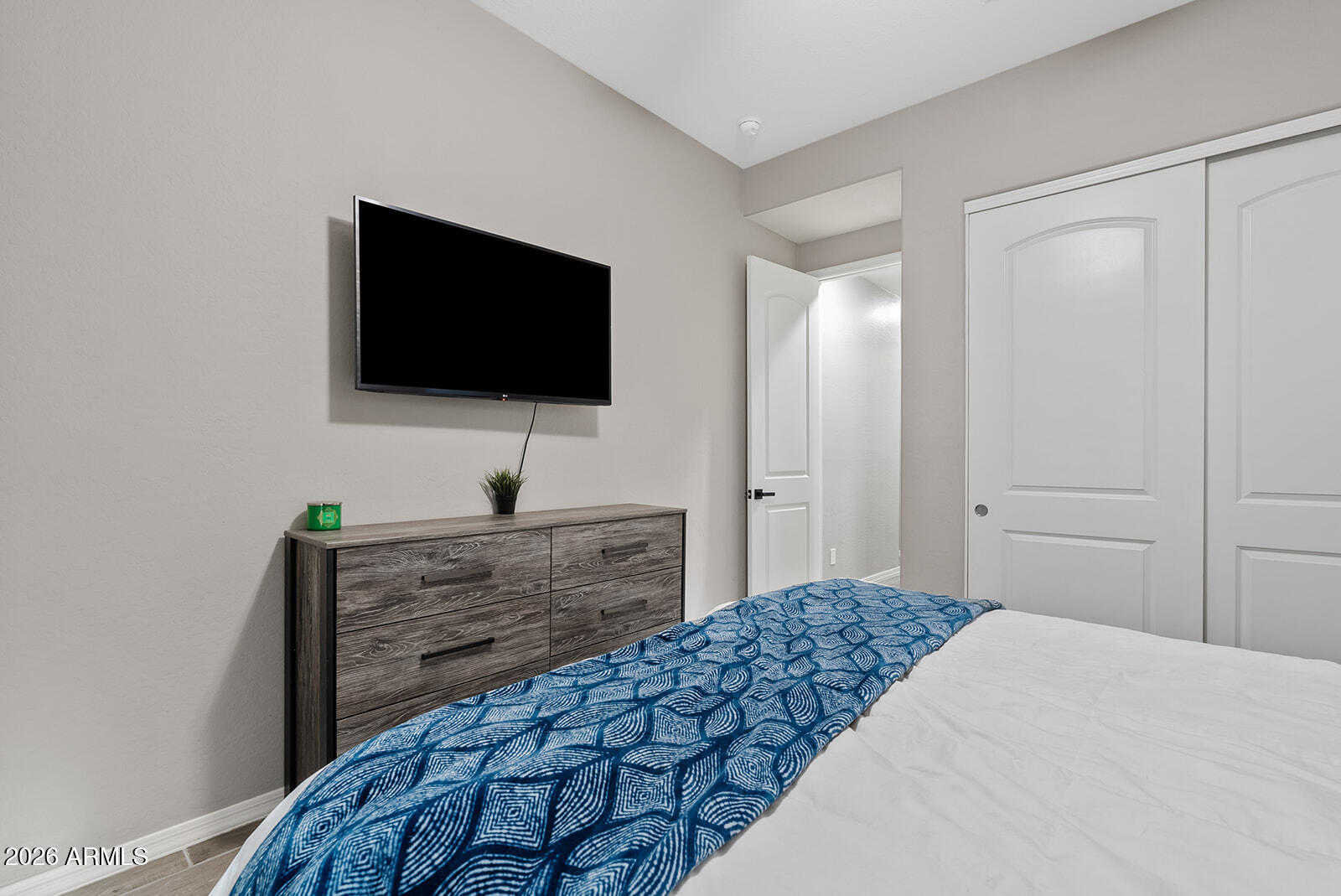 19411 East Timberline Road Queen Creek, AZ 85142 - Photo 14 of 44 a bedroom with a bed and a flat screen tv