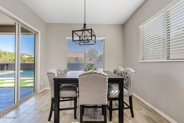 a dining room with furniture and window