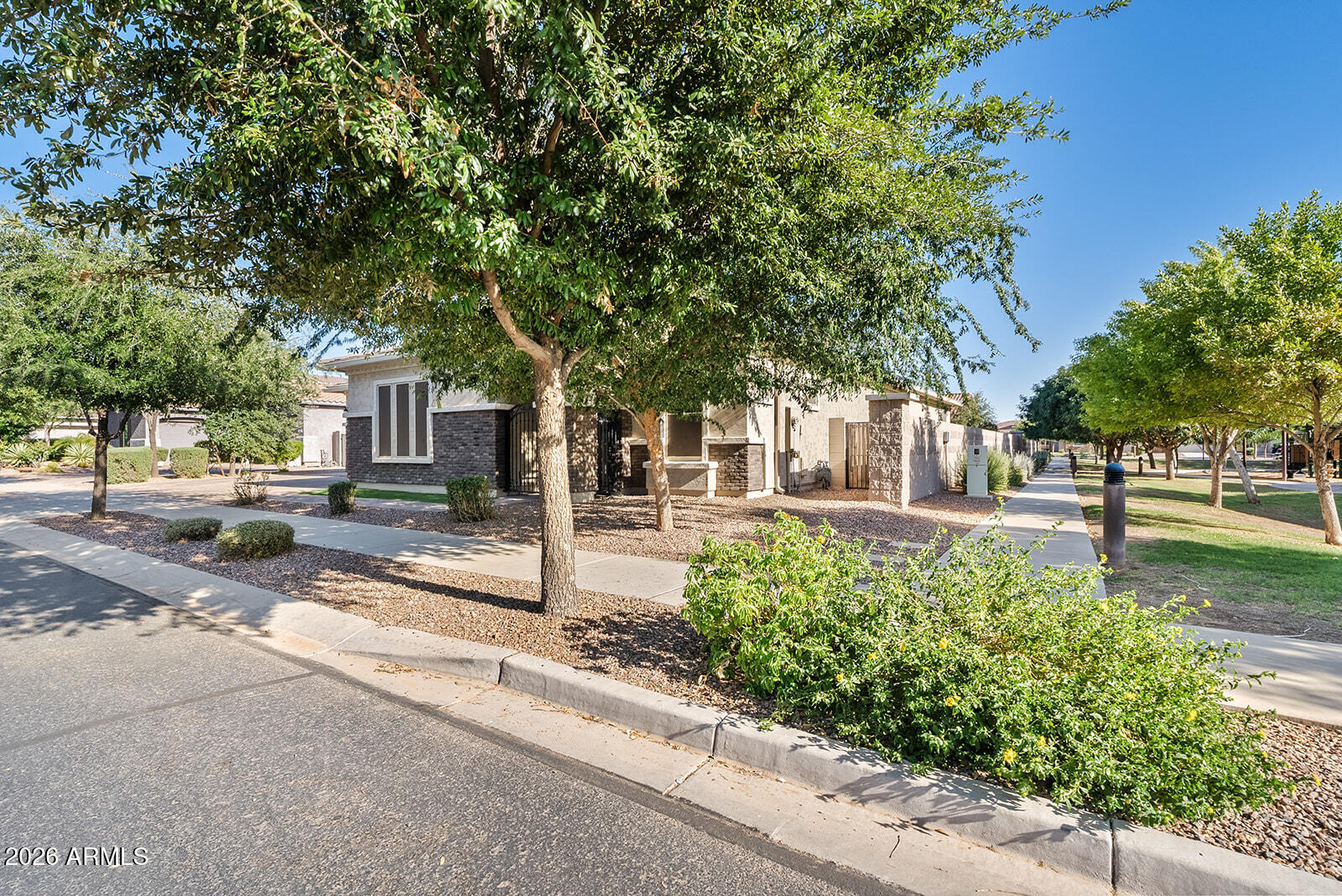 19411 East Timberline Road Queen Creek, AZ 85142 - Photo 3 of 44 a front view of a house with a yard