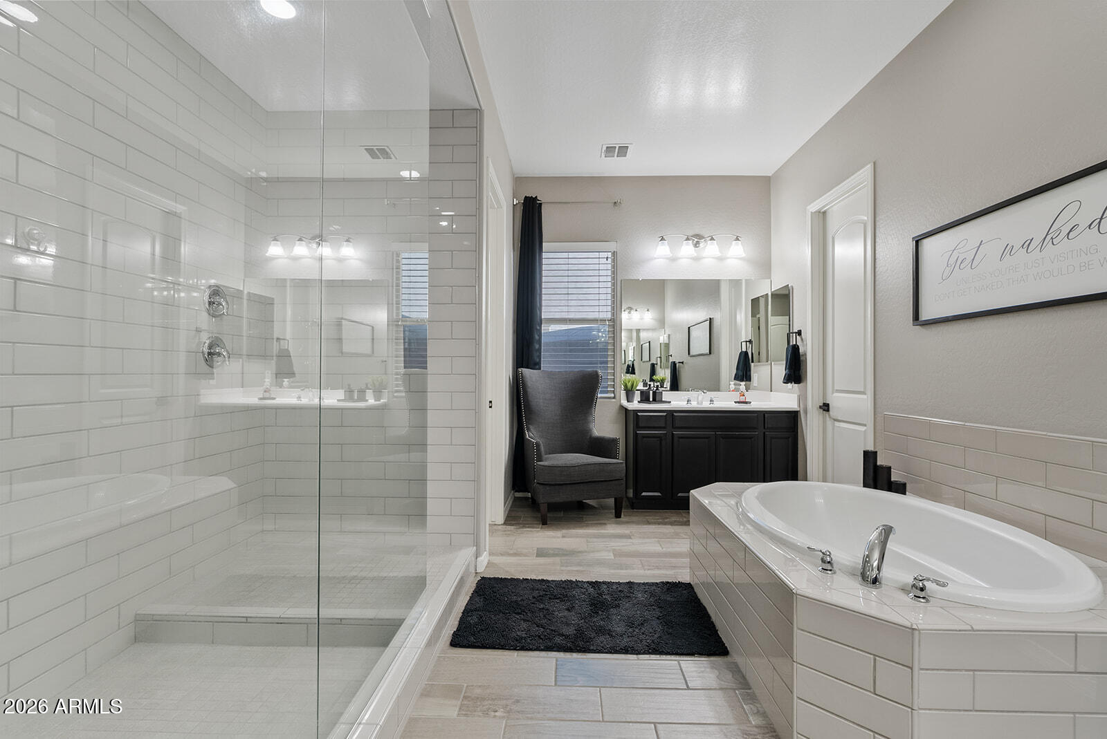 19411 East Timberline Road Queen Creek, AZ 85142 - Photo 31 of 44 a bathroom with a tub a sink a mirror and a shower
