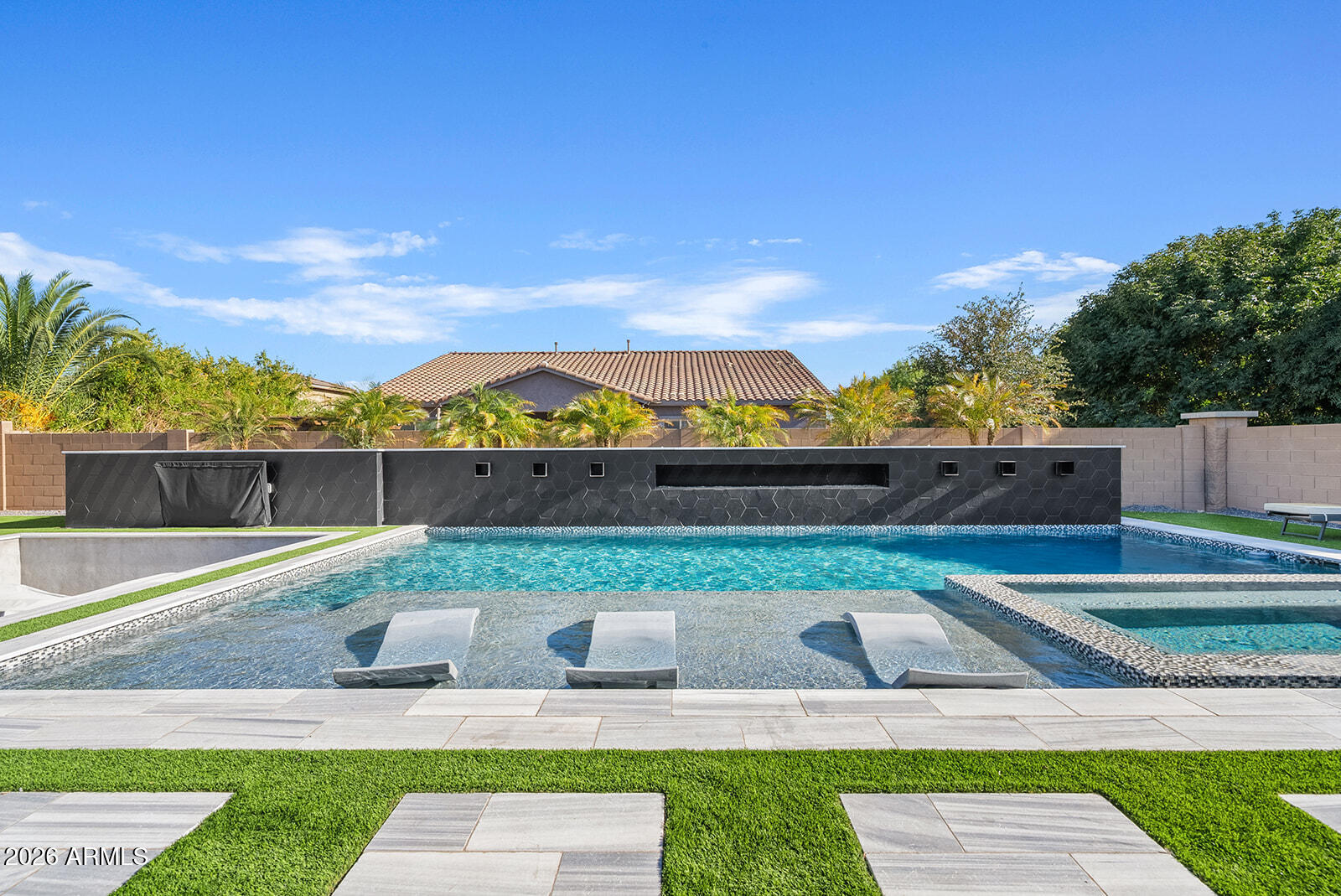 19411 East Timberline Road Queen Creek, AZ 85142 - Photo 39 of 44 a backyard of a house with table and chairs