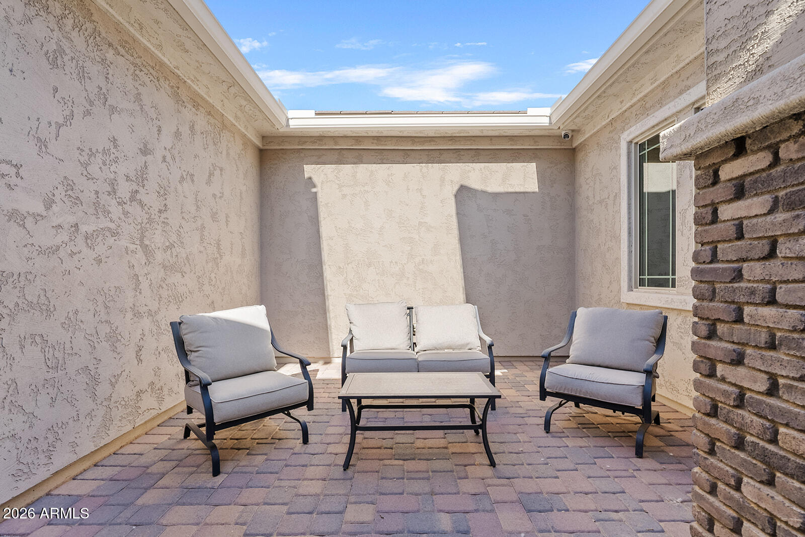 19411 East Timberline Road Queen Creek, AZ 85142 - Photo 4 of 44 a outdoor living space with a couch and a potted plant