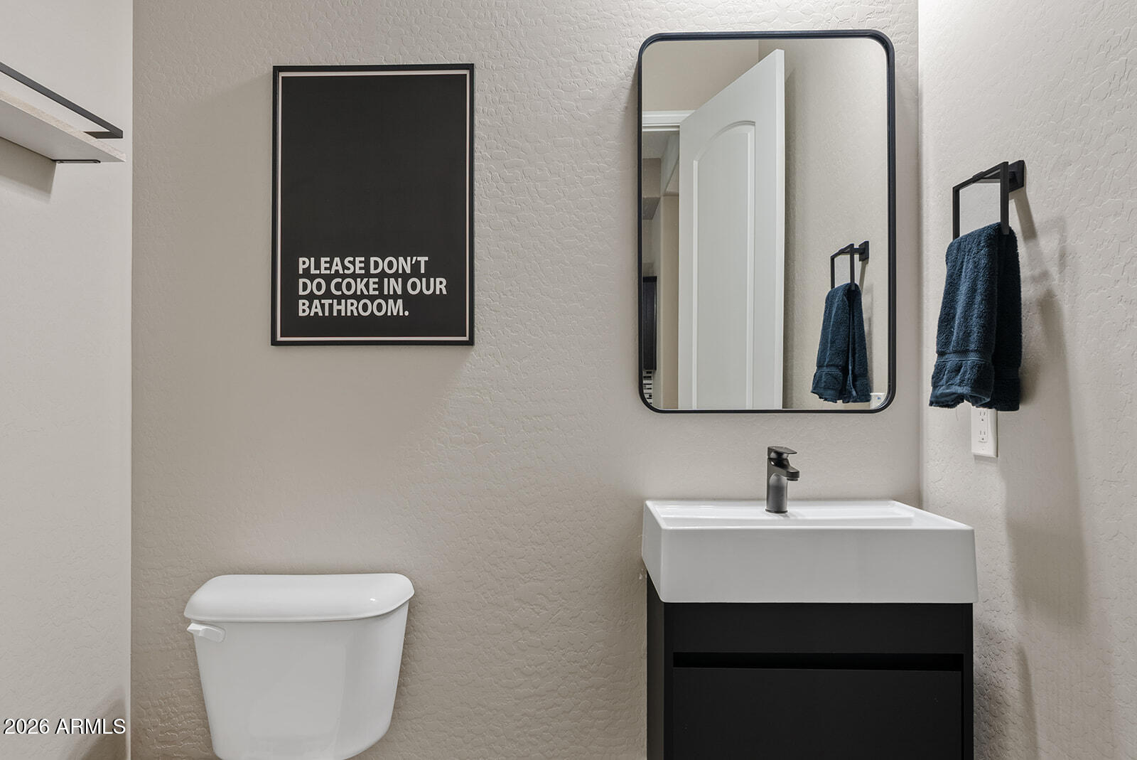 19411 East Timberline Road Queen Creek, AZ 85142 - Photo 9 of 44 a bathroom with a toilet sink and mirror