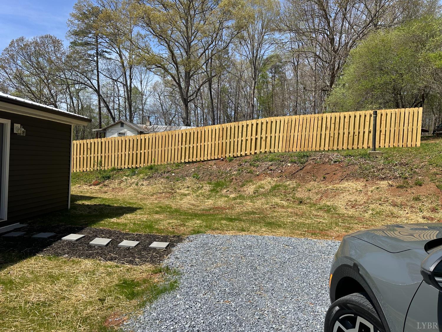 1221 Lynch Road Altavista, VA 24517 - Photo 11 of 14 a view of a yard with wooden fence