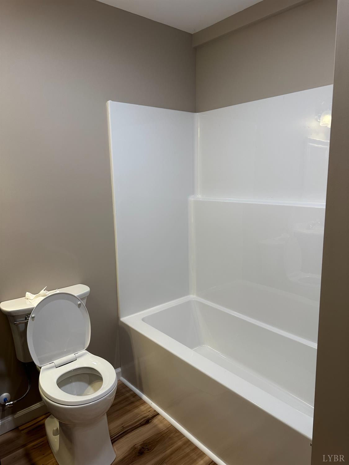 1221 Lynch Road Altavista, VA 24517 - Photo 8 of 14 a white toilet sitting next to a bath tub