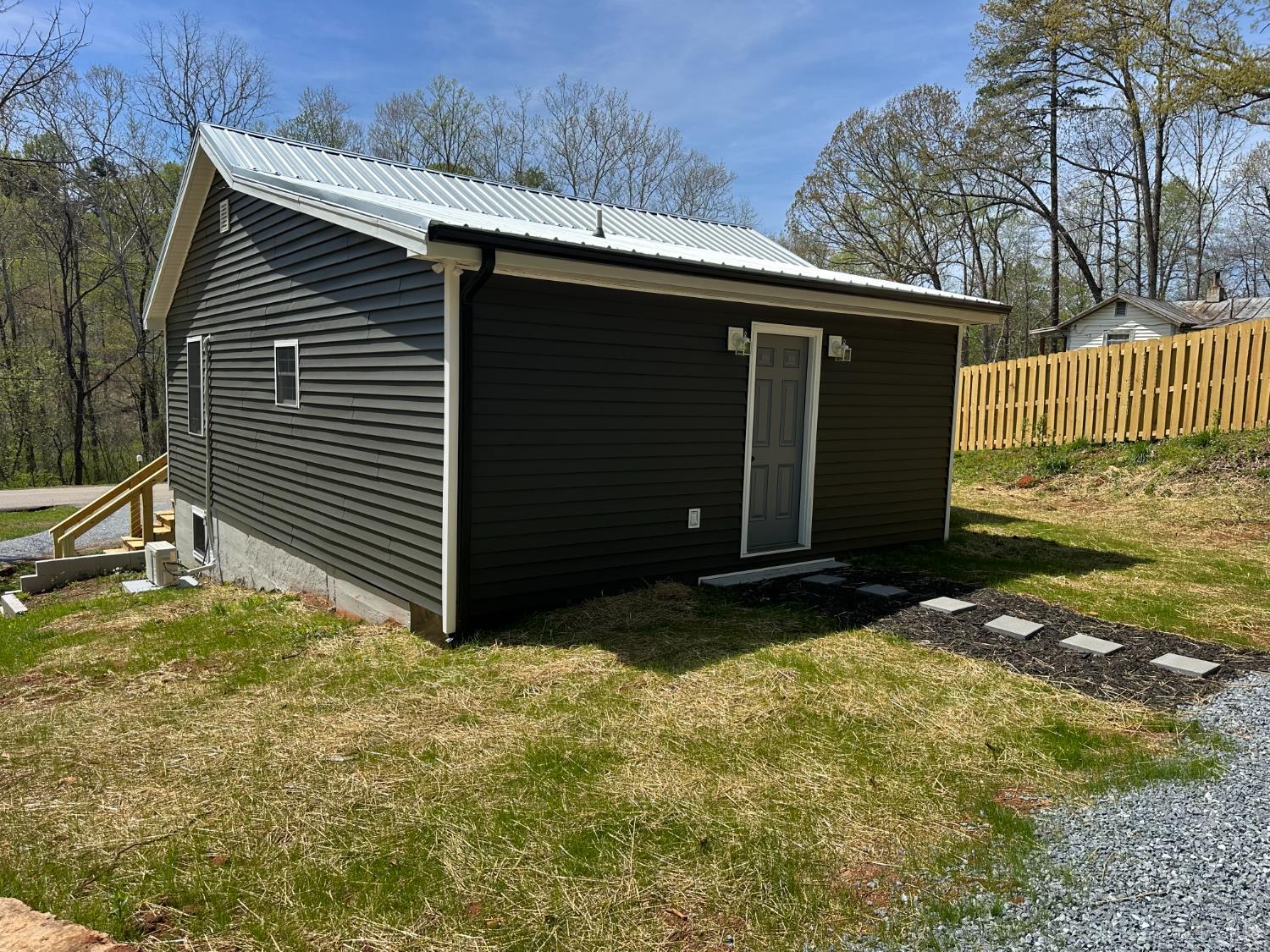 1221 Lynch Road Altavista, VA 24517 - Photo 10 of 14 a view of backyard with barbeque grill and wooden fence