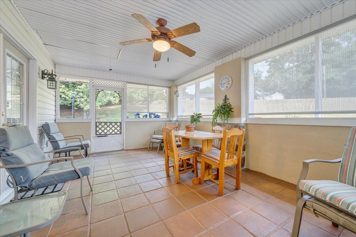 501 Olney Road Vinton, VA 24179 - Photo 18 of 49 a dining room with furniture a chandelier and wooden floor