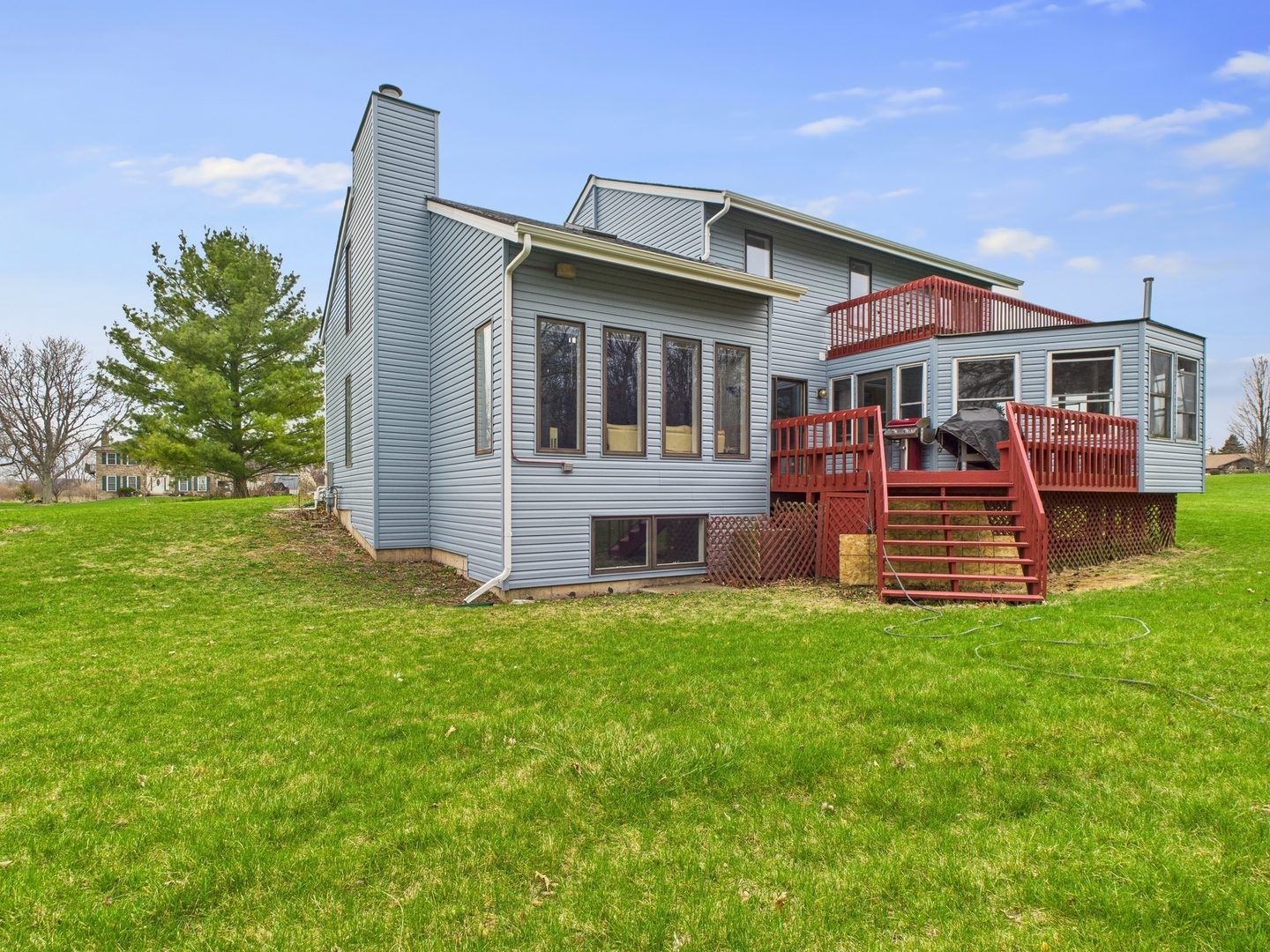 15840 Overlook Lane Huntley, IL 60142 - Photo 36 of 42 a front view of a house with a garden