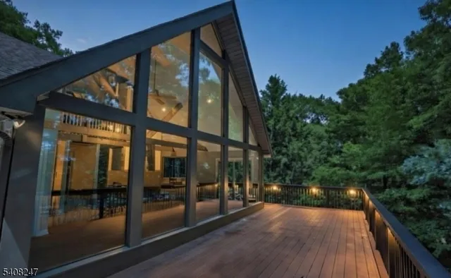 a bathroom with a toilet a window and shower