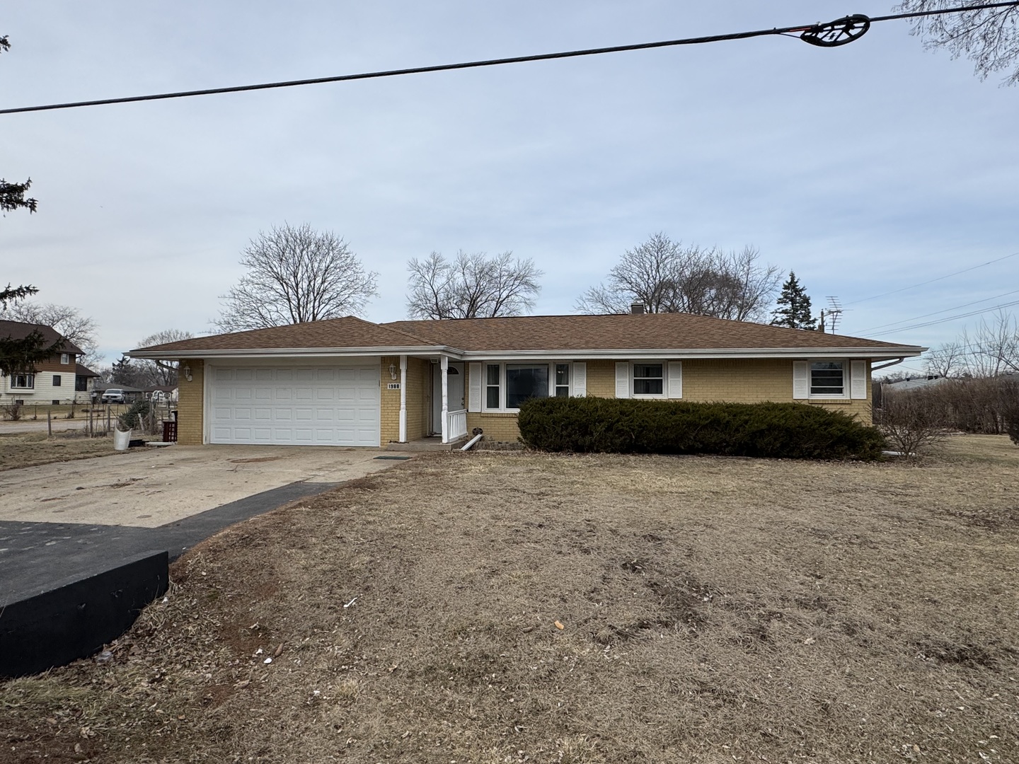 1988 South Bend Road Rockford, IL 61109 - Photo 2 of 26 a front view of a house with a yard and garage