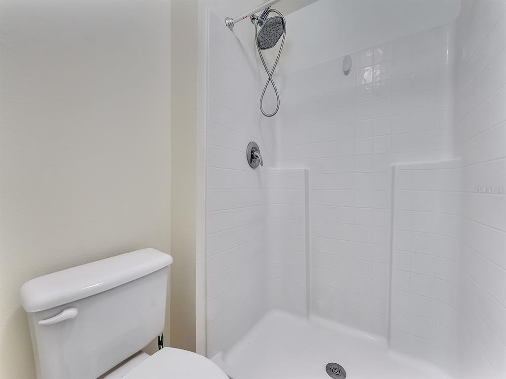 2111 Corner Point Court Orlando, FL 32820 - Photo 11 of 16 a white toilet sitting next to a bath tub