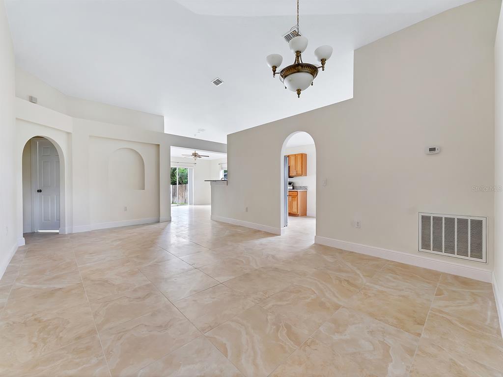 2111 Corner Point Court Orlando, FL 32820 - Photo 2 of 16 a view of a livingroom with wooden floor