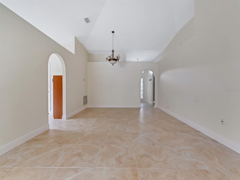 2111 Corner Point Court Orlando, FL 32820 - Photo 3 of 16 a view of a room with a chandelier and window
