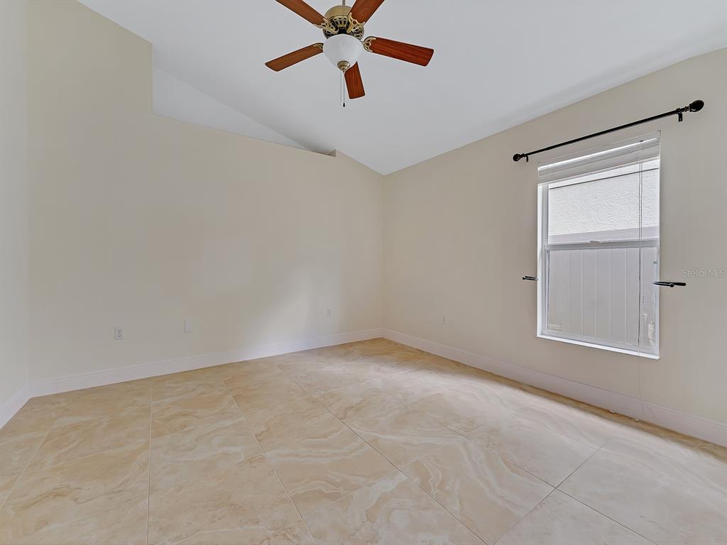 2111 Corner Point Court Orlando, FL 32820 - Photo 9 of 16 an empty room with windows and fan