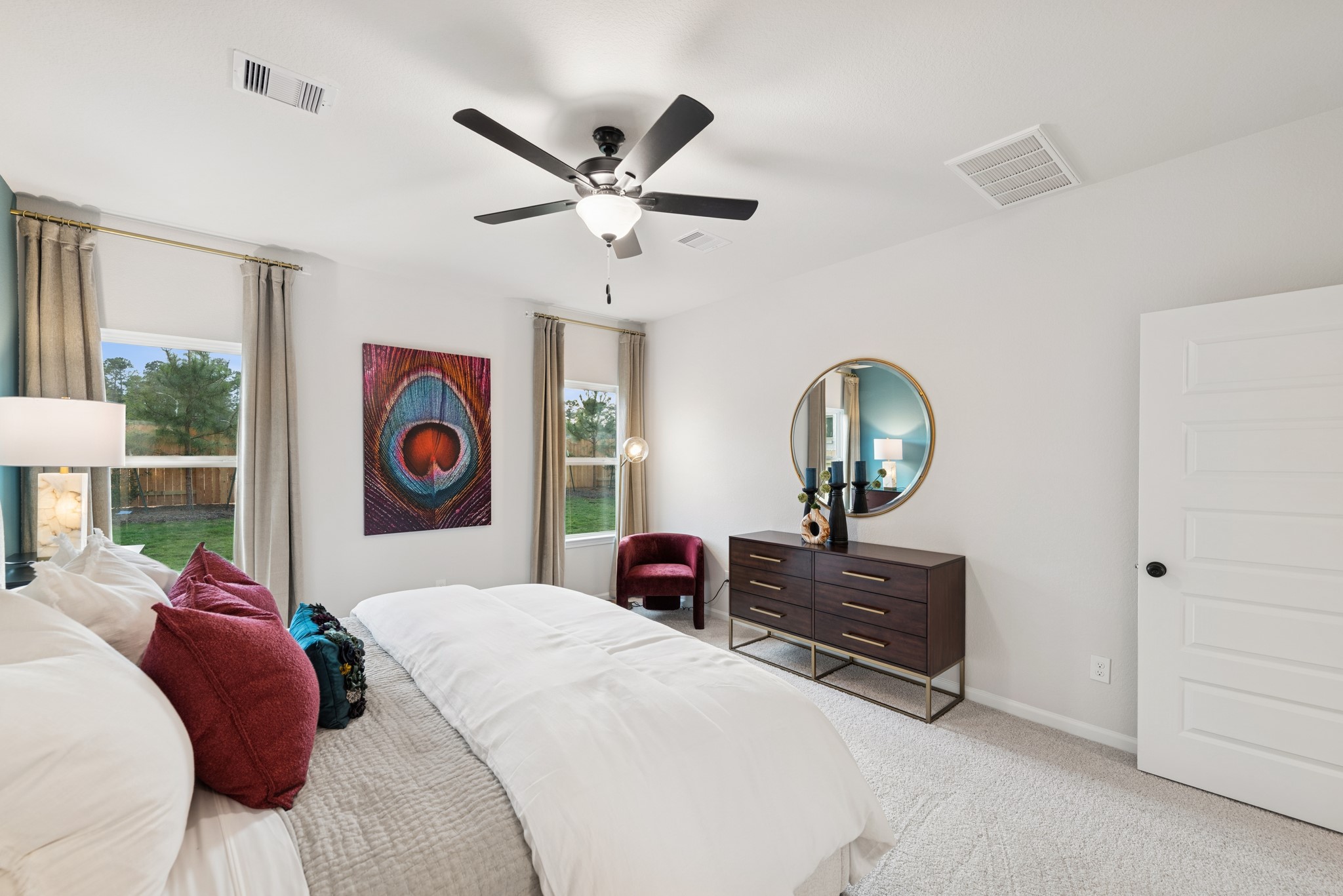 9726 Enclave Ridge Road Willis, TX 77318 - Photo 11 of 25 a bed room with a bed and a chandelier