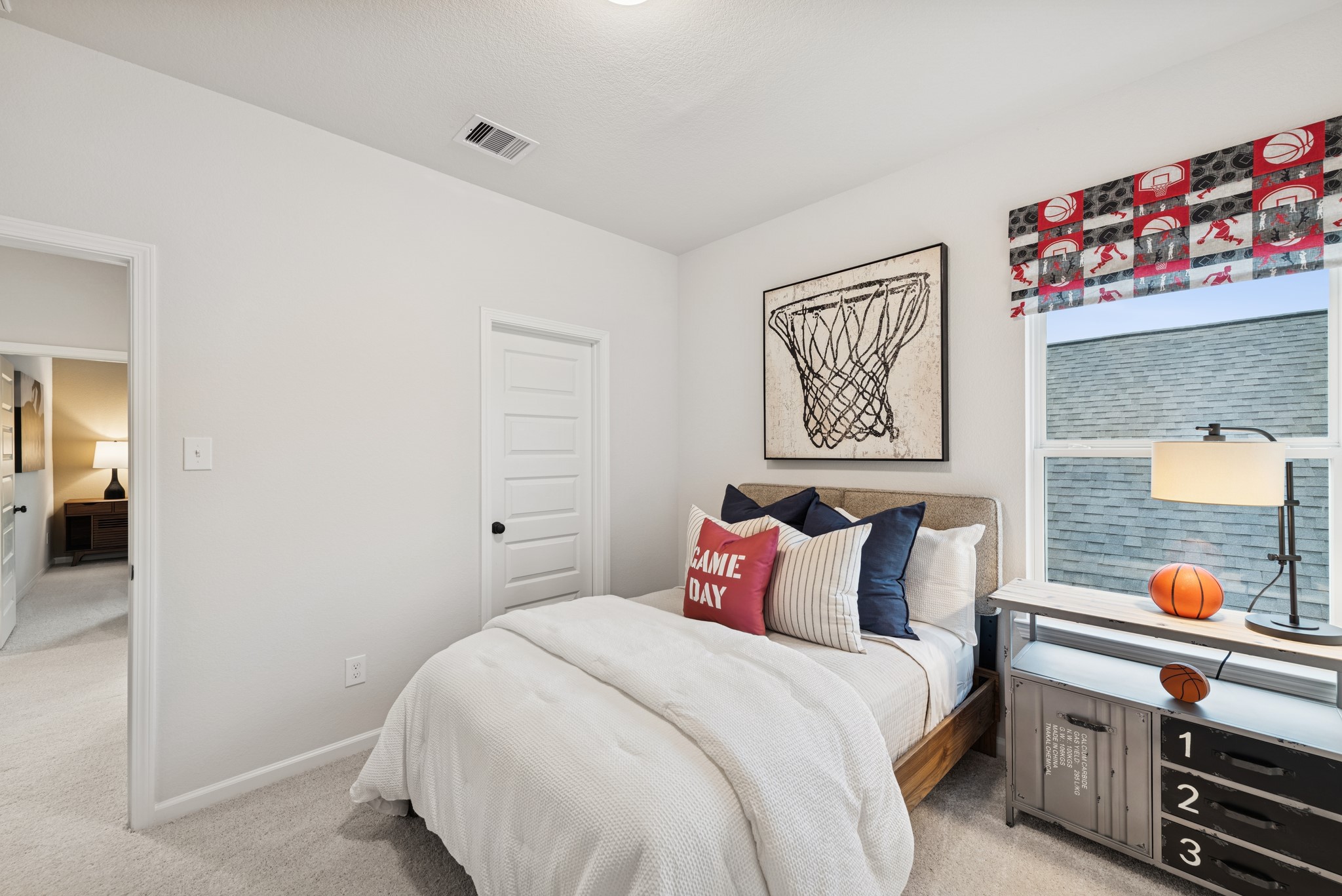 9726 Enclave Ridge Road Willis, TX 77318 - Photo 20 of 25 a bedroom with a bed and a book shelf