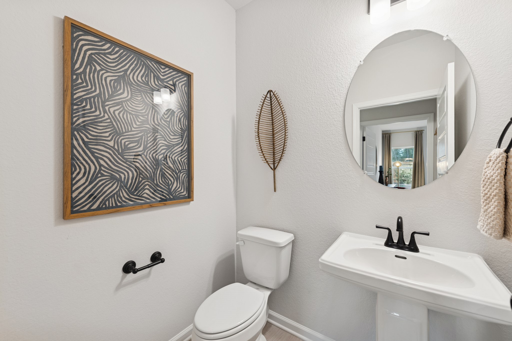 9726 Enclave Ridge Road Willis, TX 77318 - Photo 23 of 25 a bathroom with a toilet sink and mirror