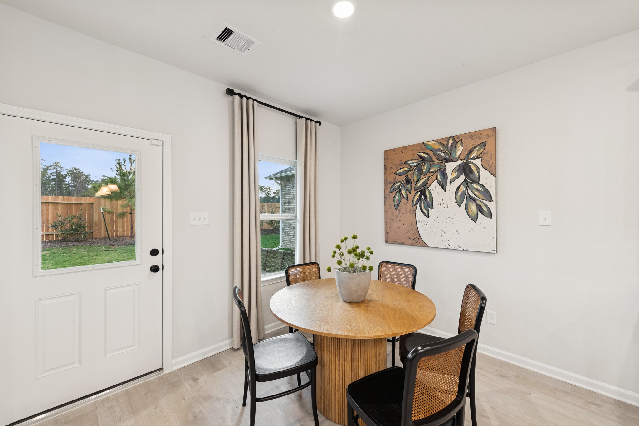 9726 Enclave Ridge Road Willis, TX 77318 - Photo 9 of 25 a view of a dining room with furniture window and wooden floor