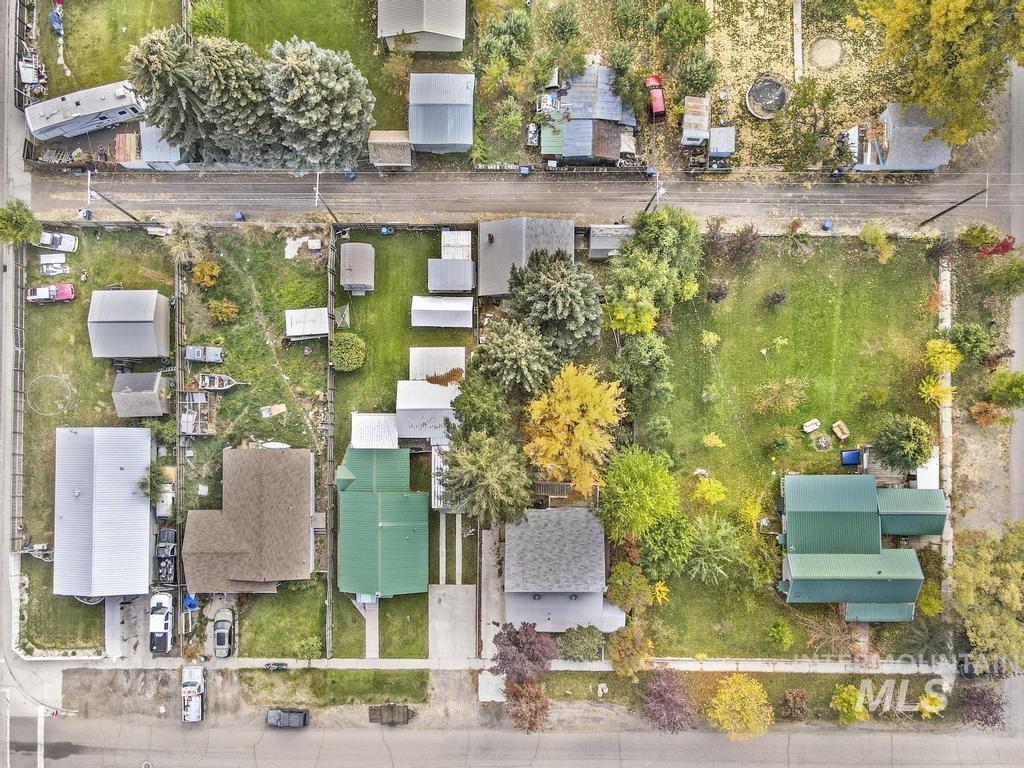 111 2nd Street Rupert, ID 83350 - Photo 35 of 45 Aerial perspective showcasing a neighborhood with varied property sizes and mature trees