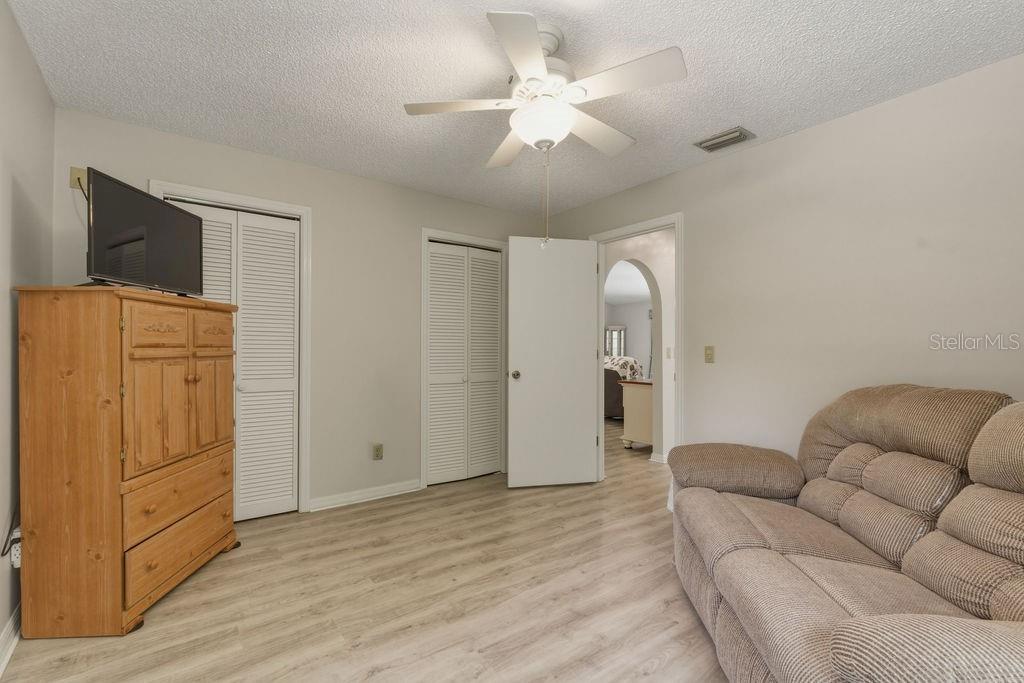 8873 Southwest 200th Circle Dunnellon, FL 34431 - Photo 19 of 61 a living room with furniture and wooden floor