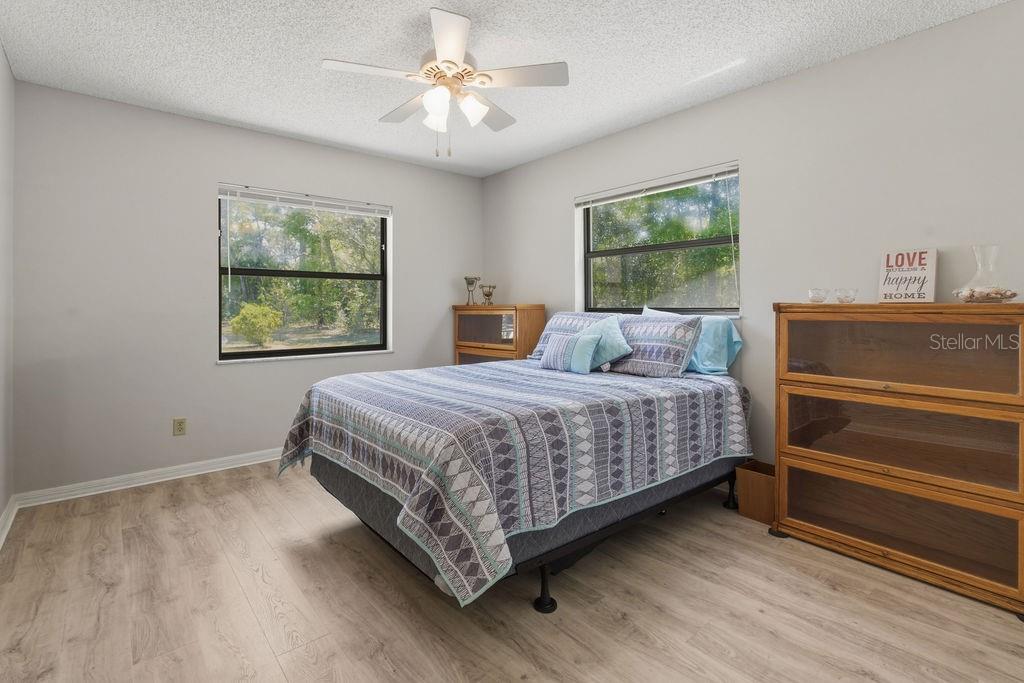 8873 Southwest 200th Circle Dunnellon, FL 34431 - Photo 21 of 61 a bedroom with a large bed and a window