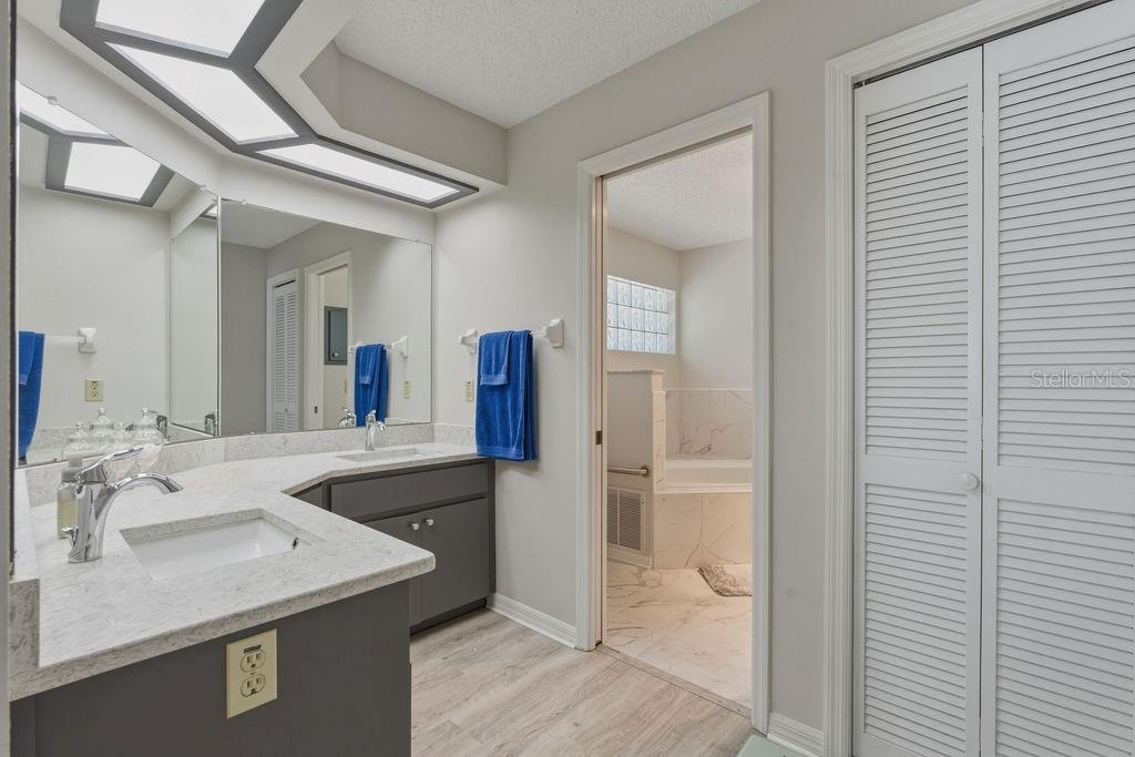 8873 Southwest 200th Circle Dunnellon, FL 34431 - Photo 26 of 61 a bathroom with a sink and a mirror