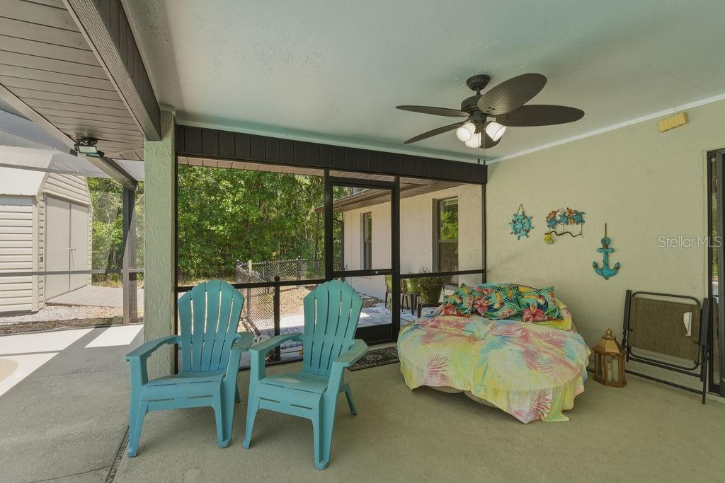 8873 Southwest 200th Circle Dunnellon, FL 34431 - Photo 32 of 61 a bed room with a bed and a chair