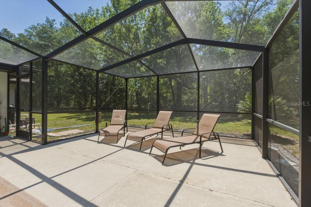 8873 Southwest 200th Circle Dunnellon, FL 34431 - Photo 35 of 61 a view of chair and tables in the patio